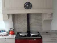 light grey kitchen with red cooker