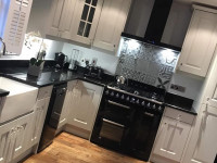 White kitchen with black apliances